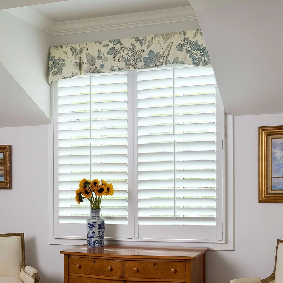 Floral valance above plantation shutters, offered by Window Coverings by Julie in Cave Creek