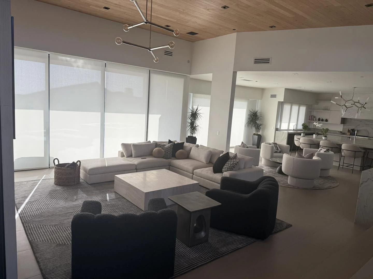 solar-shades-wall-of-glass-living-room Solar shades across a wall of glass, installed by Window Coverings by Julie